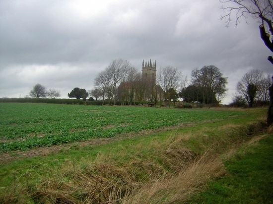 View across the fields towards one of our churches